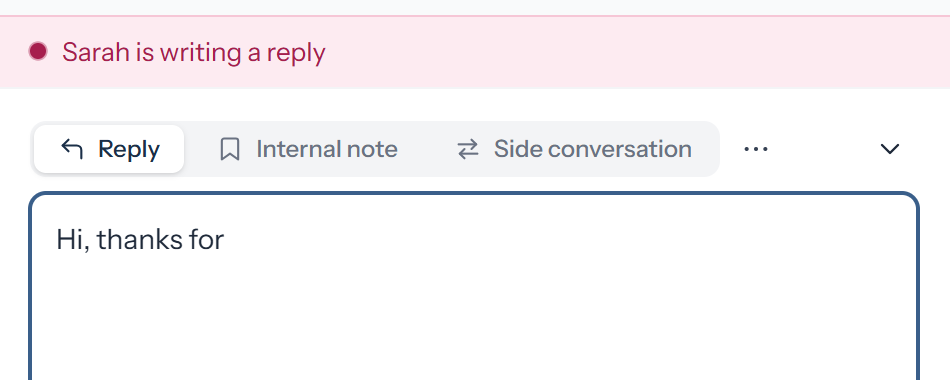 A pink notice above the reply box reading "Sarah is writing a reply" while another reply is being typed